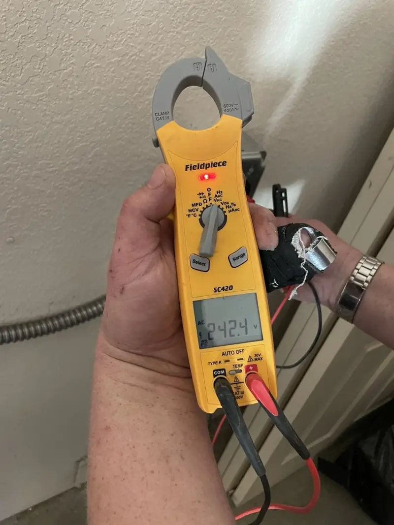 Voltage testing with clamp meter during Outlet Installation in Norridgewock